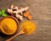 flat-lay-top-view-turmeric-curcumin-powder-wooden-bowl-spoon-with-fresh-rhizome-wood-background_252965-741